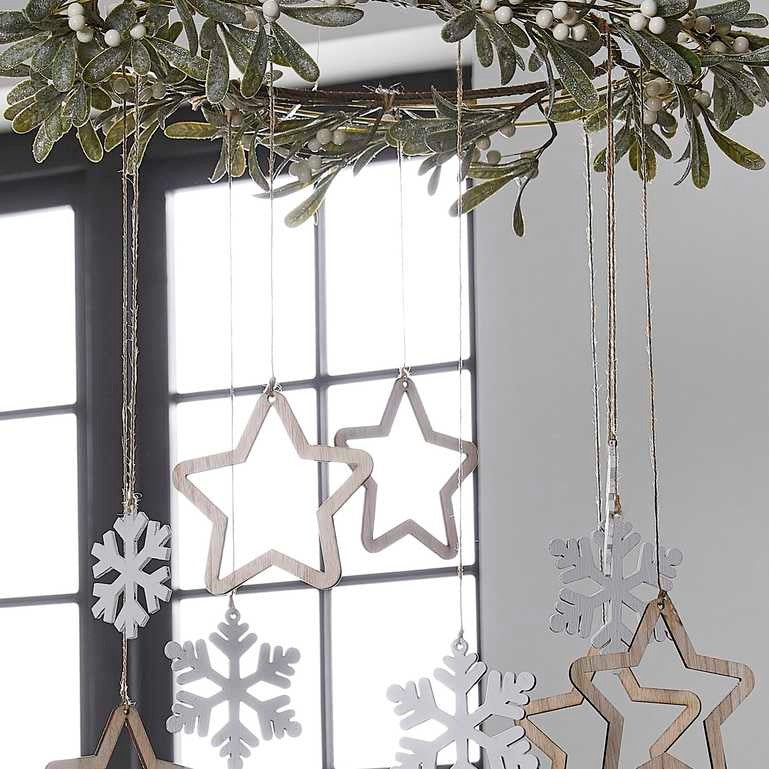 Hanging decoration with golden stars and snowflakes