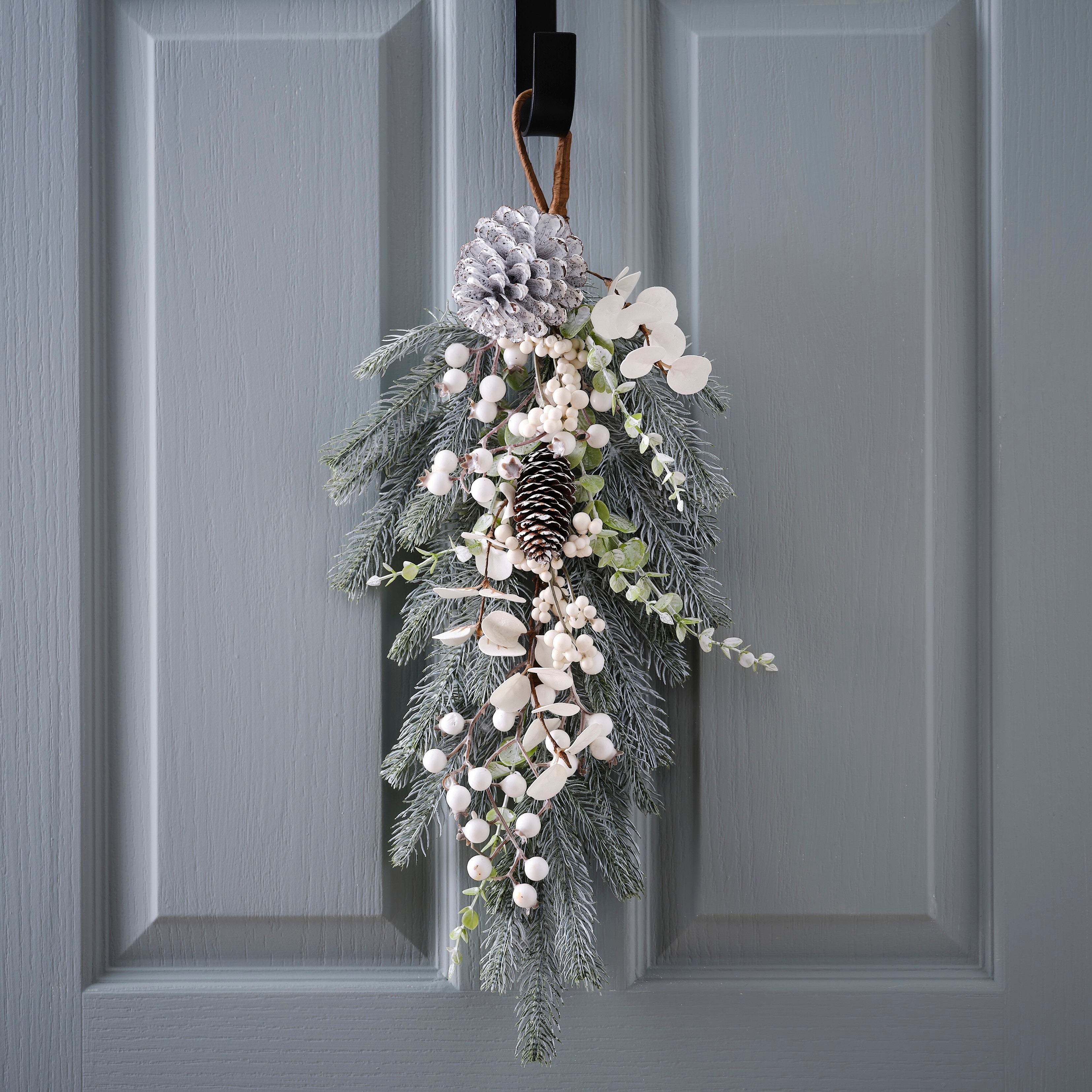 Hanging decoration with branches and cones